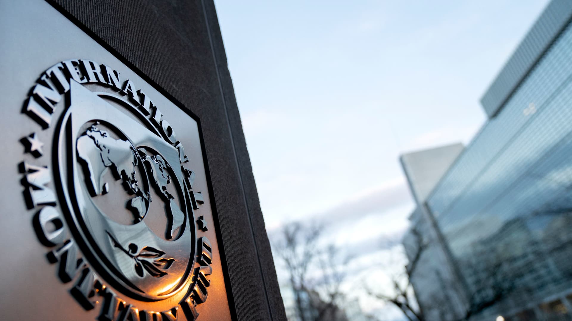The seal for the International Monetary Fund is seen near the World Bank headquarters (R) in Washington, DC on January 10, 2022.