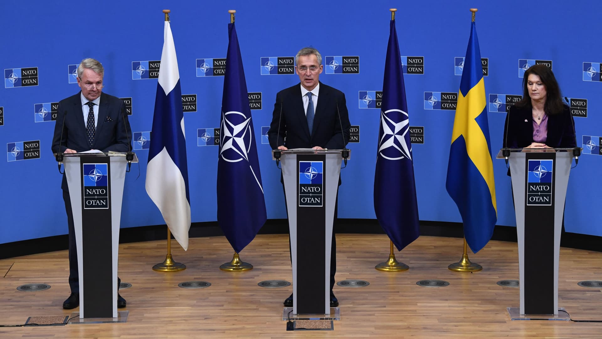 NATO Secretary General Jens Stoltenberg (C), Finland Ministers for Foreign Affairs Pekka Haavisto (L) and Sweden Foreign minister Ann Linde (R) give a press conference after their meeting at the Nato headquarters in Brussels on January 24, 2022.