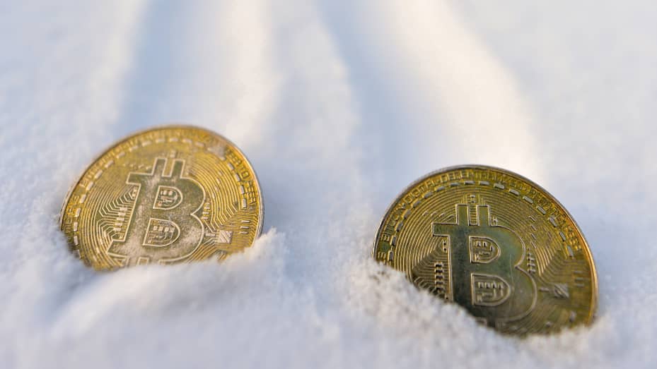 Illustrative image of two commemorative bitcoins seen in the snow. On Thursday, January 6, 2021, in Edmonton, Alberta, Canada.
