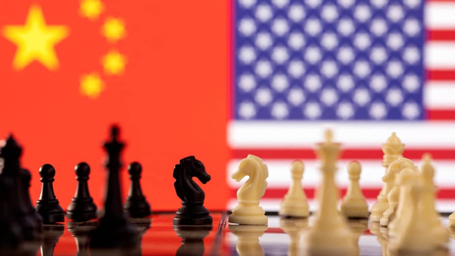 Chess pieces are seen in front of displayed China's and U.S. flags in this illustration taken January 25, 2022.