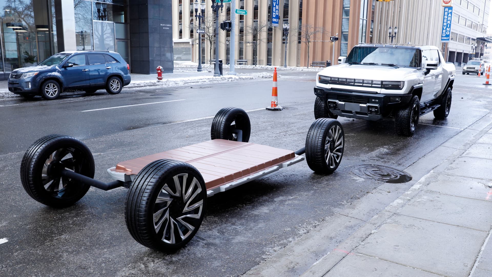 A battery pack and GM's new Hummer EV stand outside an event where General Motors announced an investment of more than $7 billion in four Michigan manufacturing sites on January 25, 2022 in Lansing, Michigan.