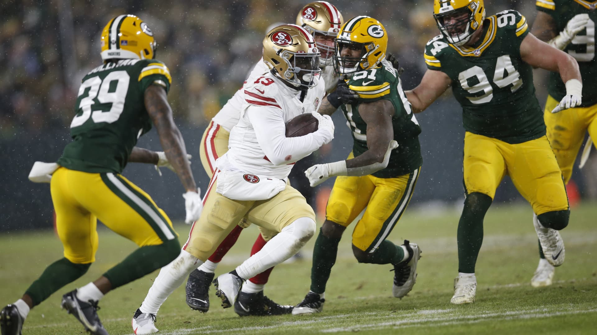 Deebo Samuel #19 of the San Francisco 49ers rushes during the game against the Green Bay Packers in the NFC Divisional Playoff game at Lambeau Field on January 22, 2022 in Green Bay, Wisconsin.