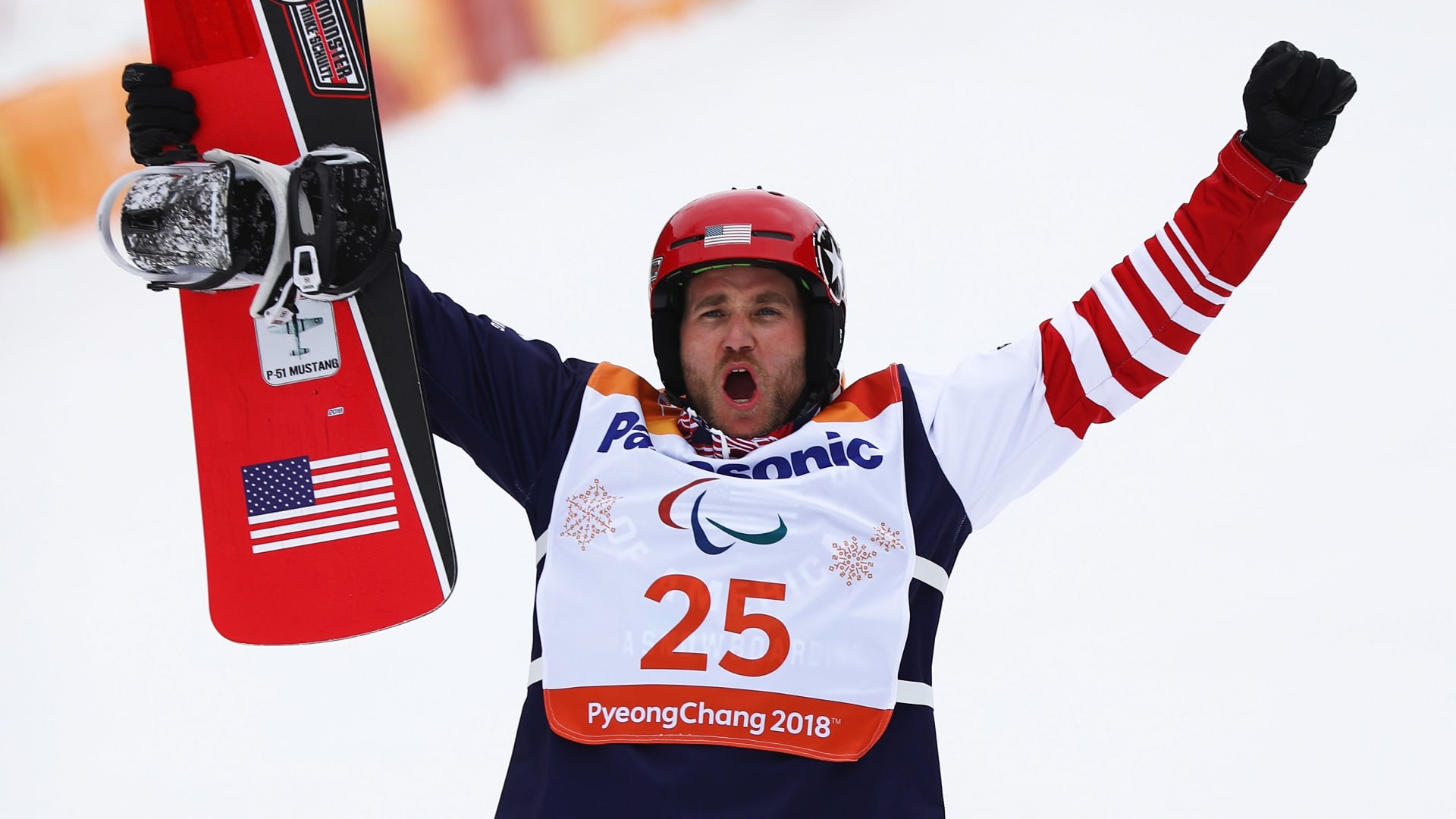 Snowboarder Mike Schultz of the United States celebrates during the victory ceremony for the Men's Snowboard Banked Slalom SB-LL1 at the PyeongChang 2018 Paralympic Games.