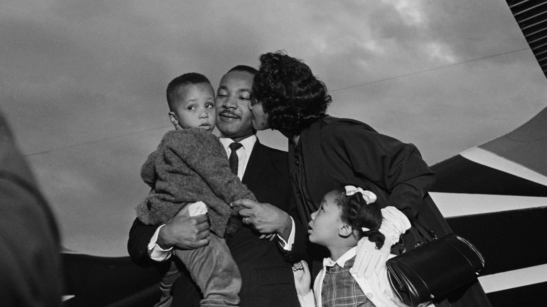 After Dr. Martin Luther King, Jr. is freed from jail under a $2000 appeal bond, he is greeted by his wife Coretta and children, Marty and Yoki, at the airport in Chamblee, Georgia.
