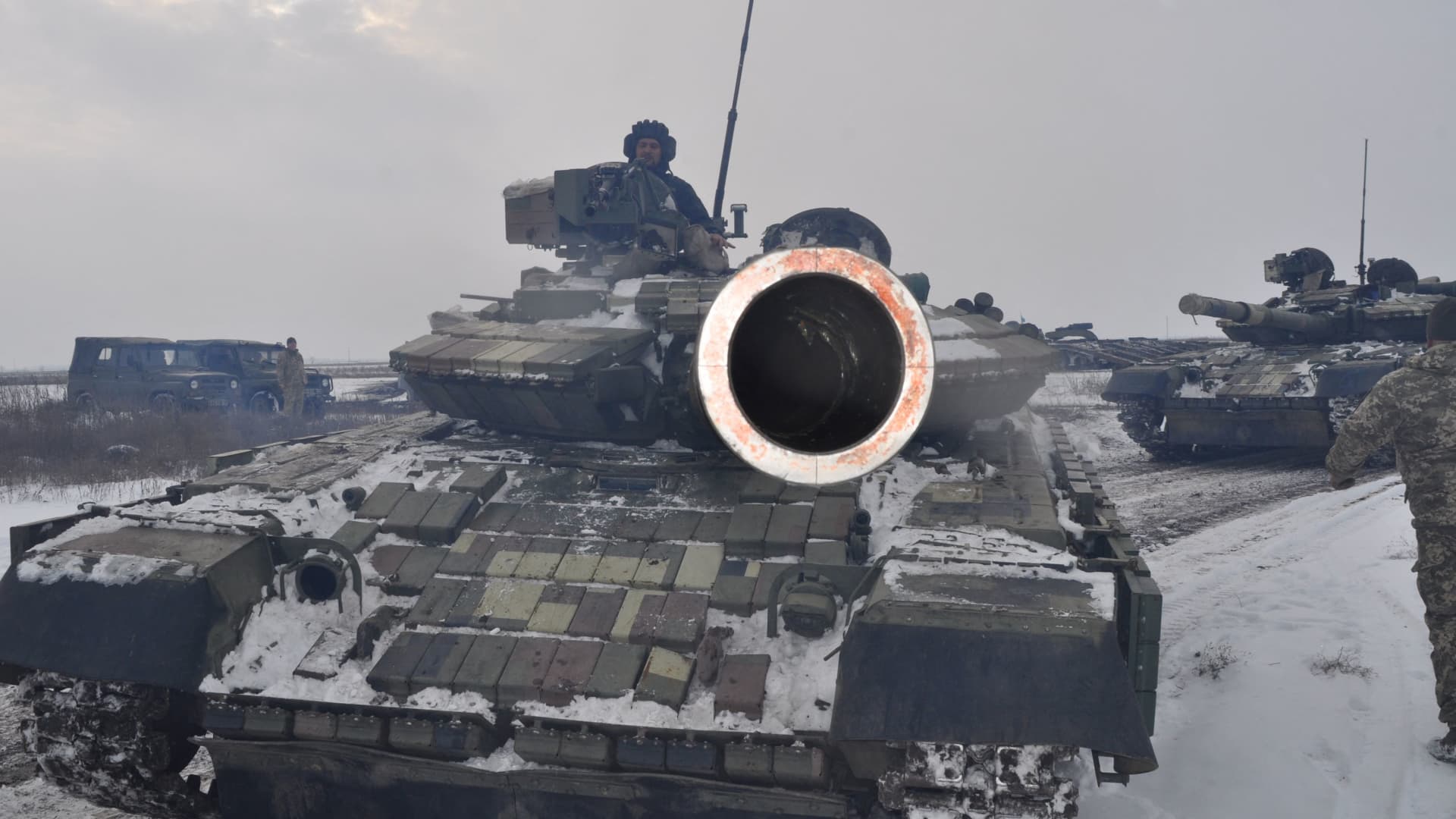 Service members of the Ukrainian Armed Forces drive tanks during tactical drills at a training ground in the Kherson region, Ukraine, in this handout picture released February 7, 2022.