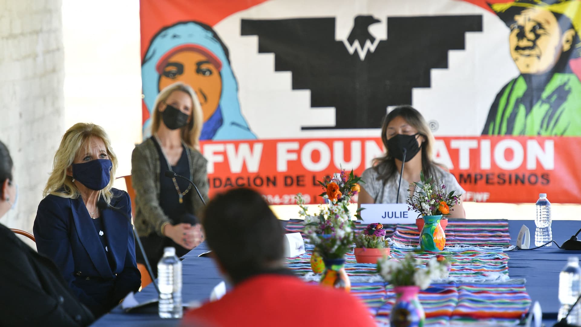 US First Lady Jill Biden (2L) chats with Latina farm workers during her visit at The Forty Acres, the first headquarters of the United Farm Workers labor union, in Delano, California on March 31, 2021.