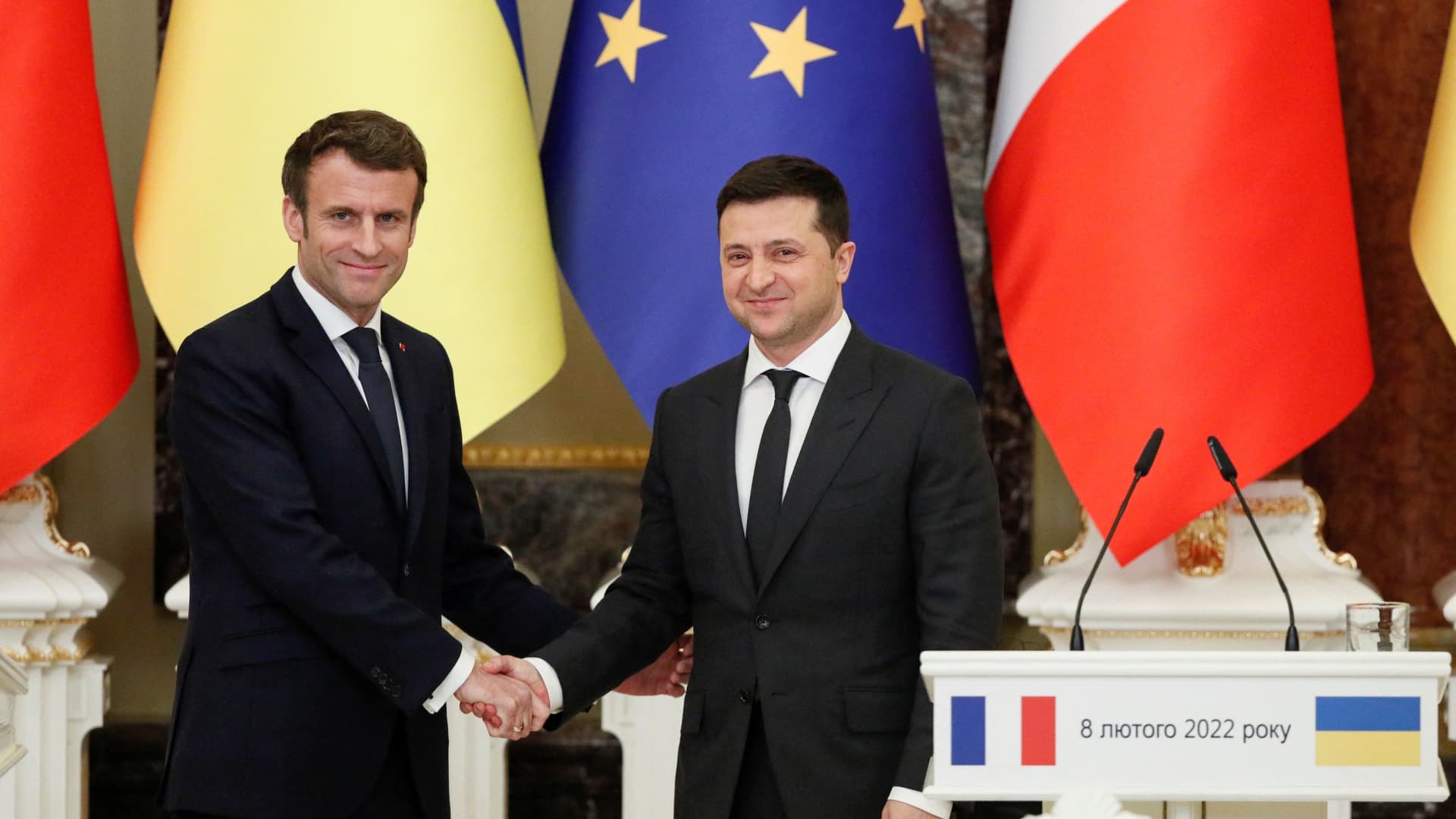 Ukrainian President Volodymyr Zelenskyy shakes hands with French President Emmanuel Macron during a news briefing following their talks in Kyiv, Ukraine on February 8, 2022.