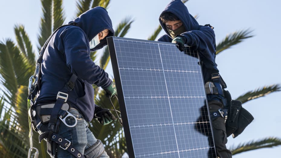 Contractors install SunRun solar panels on the roof of a home in San Jose, California, on Monday, Feb. 7, 2022.