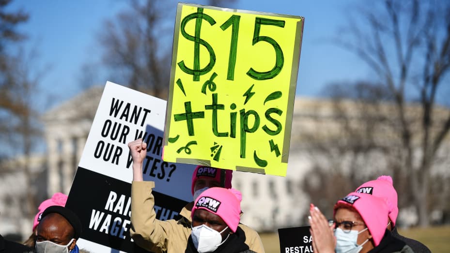 Activists demonstrate in support of a $15-per-hour minimum wage and tips for restaurant workers in Washington, D.C. on Feb. 8, 2022.