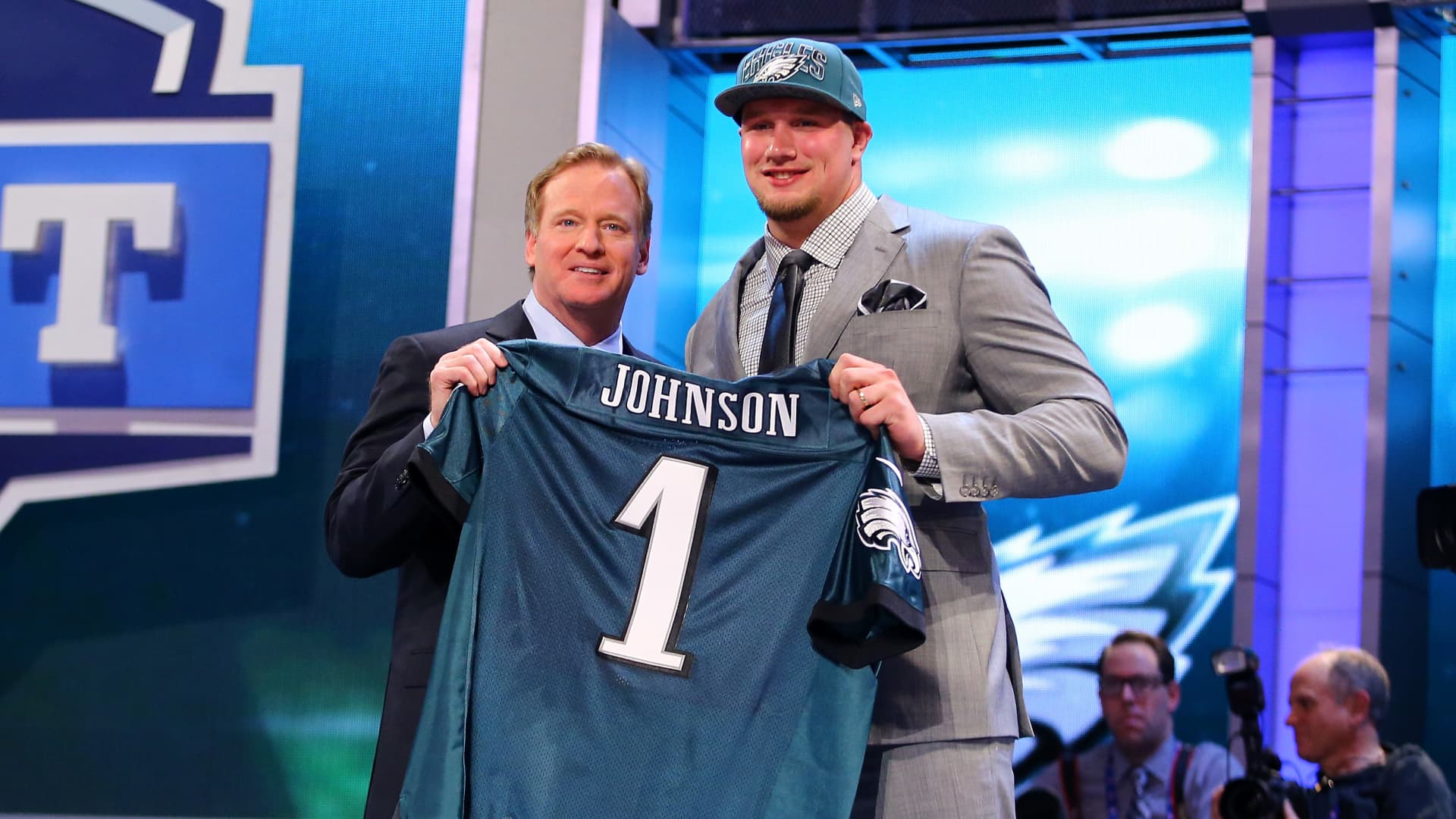 Lane Johnson stands with NFL Commissioner Roger Goodell (L) as they hold up a jersey on stage after Johnson was picked #4 overall by the Philadelphia Eagles in the first round of the 2013 NFL Draft at Radio City Music Hall on April 25, 2013 in New York City.