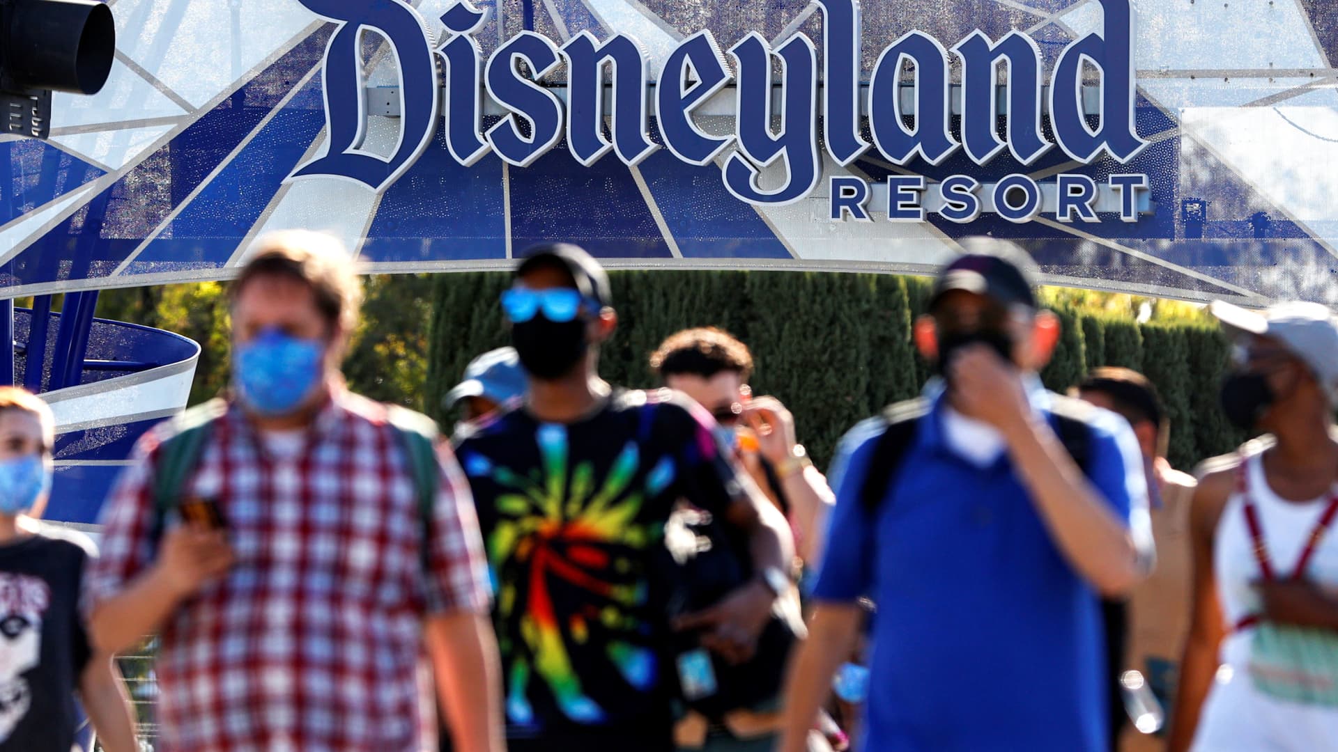 People leave the Disneyland Resort on Disneyland Park and Disney California Adventure's reopening day amidst the coronavirus disease (COVID-19) outbreak, in Anaheim, California, April 30, 2021.