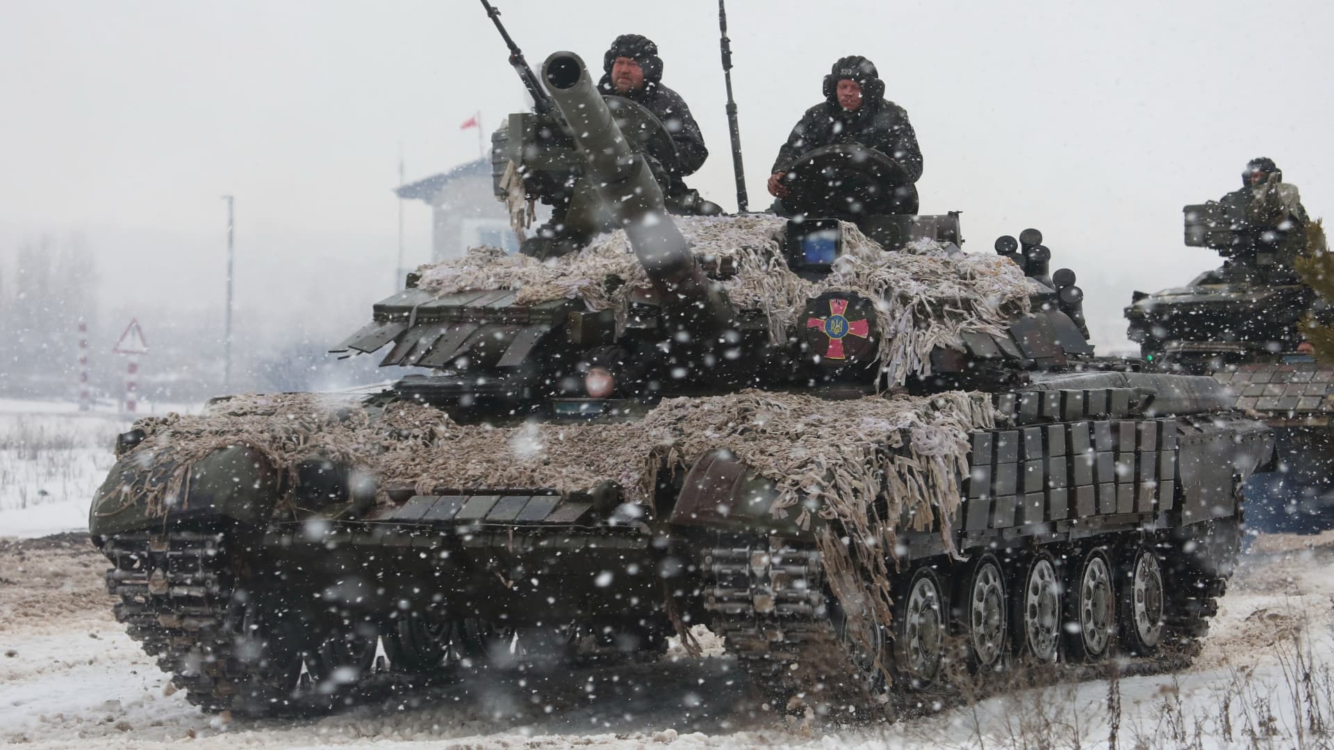 Service members of the Ukrainian Armed Forces drive a tank during military exercises in Kharkiv region, Ukraine February 10, 2022.