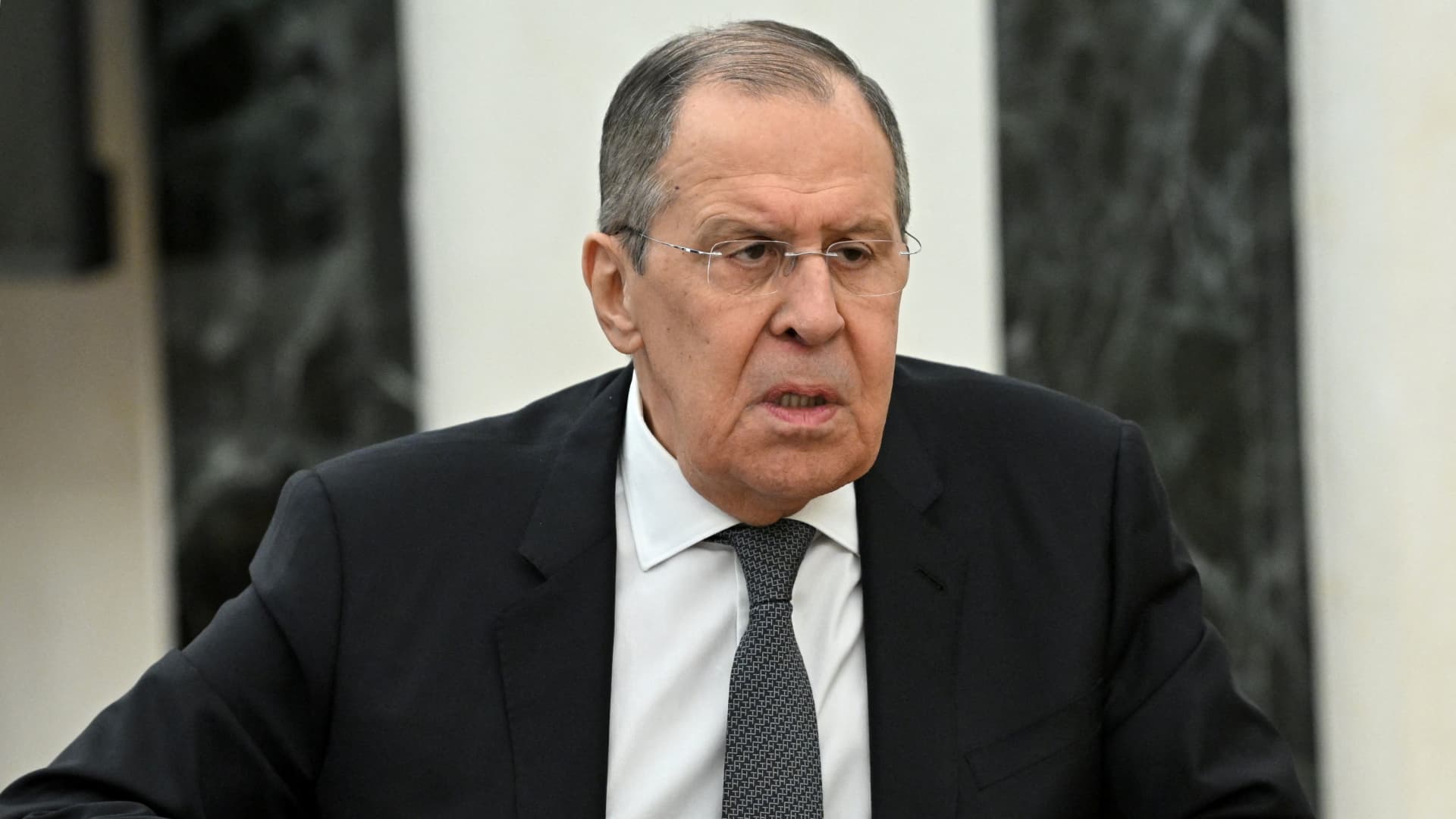 Russian Foreign Minister Sergei Lavrov attends a meeting with Russian President Vladimir Putin in Moscow, Russia February 14, 2022.