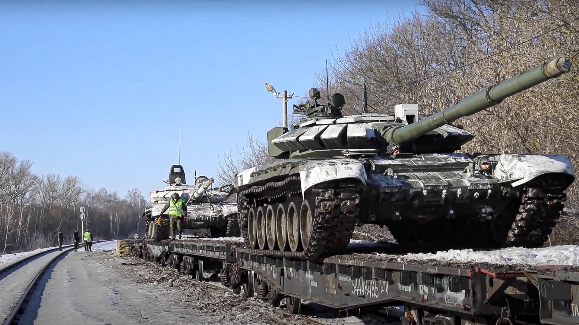 In this photo taken from video provided by the Russian Defense Ministry Press Service on Wednesday, Feb. 16, 2022, Russian army tanks are loaded onto railway platforms to move back to their permanent base after drills in Russia.