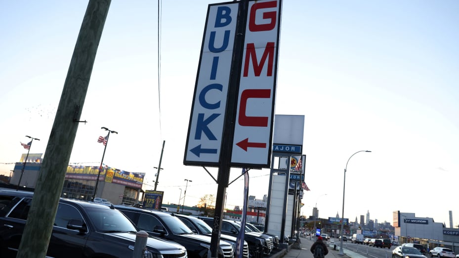 Signs advertising Buick and GMC, brands owned by General Motors Company, are seen at a car dealership in Queens, New York, November 16, 2021.