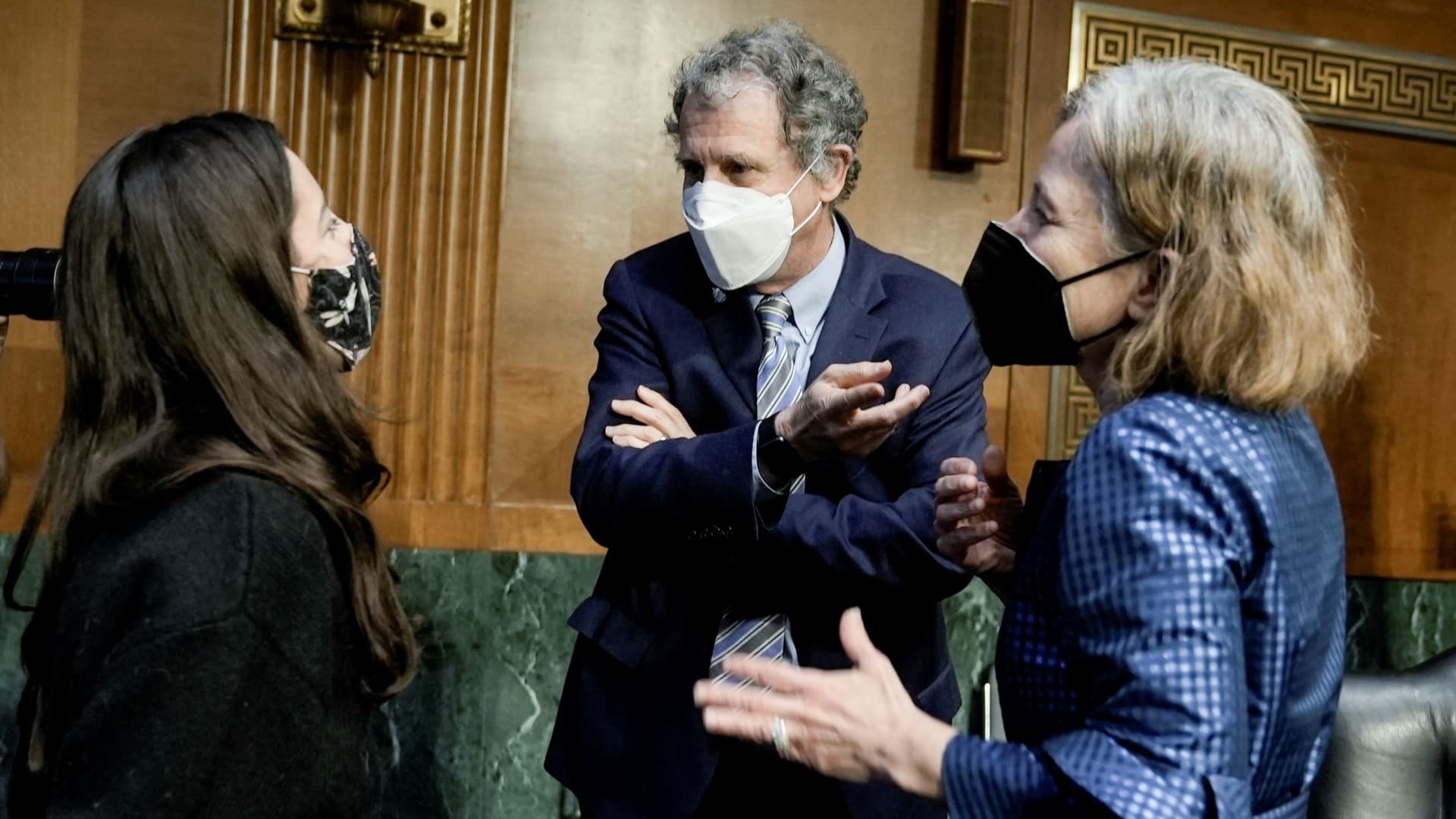 U.S. Senator Sherrod Brown (D-OH) chats with Sarah Bloom Raskin, who is nominated to be vice chairman for supervision and a member of the Federal Reserve Board of Governors, and her daughter Hannah Raskin, following a Senate Banking, Housing and Urban Affairs Committee confirmation hearing on Capitol Hill in Washington, D.C., U.S., February 3, 2022.