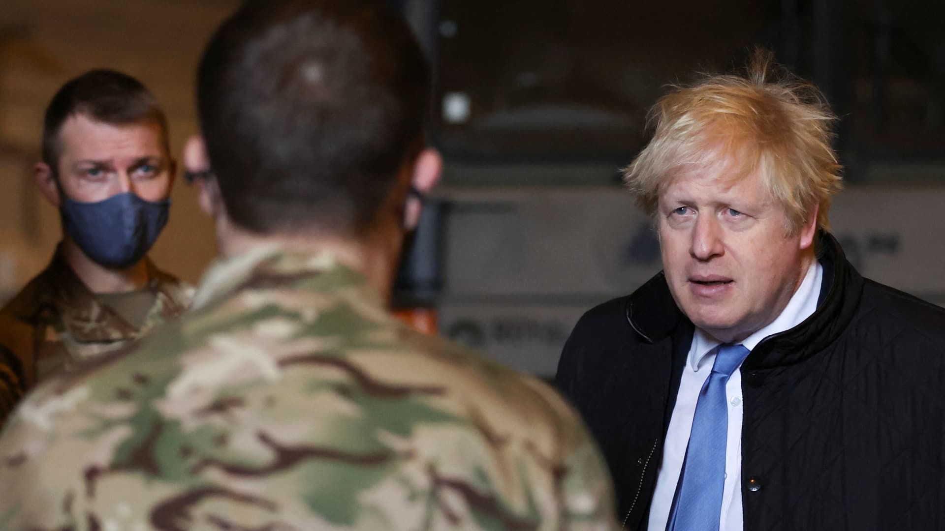 British Prime Minister Boris Johnson arrives at Royal Air Force Station Waddington, in Waddington, Lincolnshire, Britain February 17, 2022.