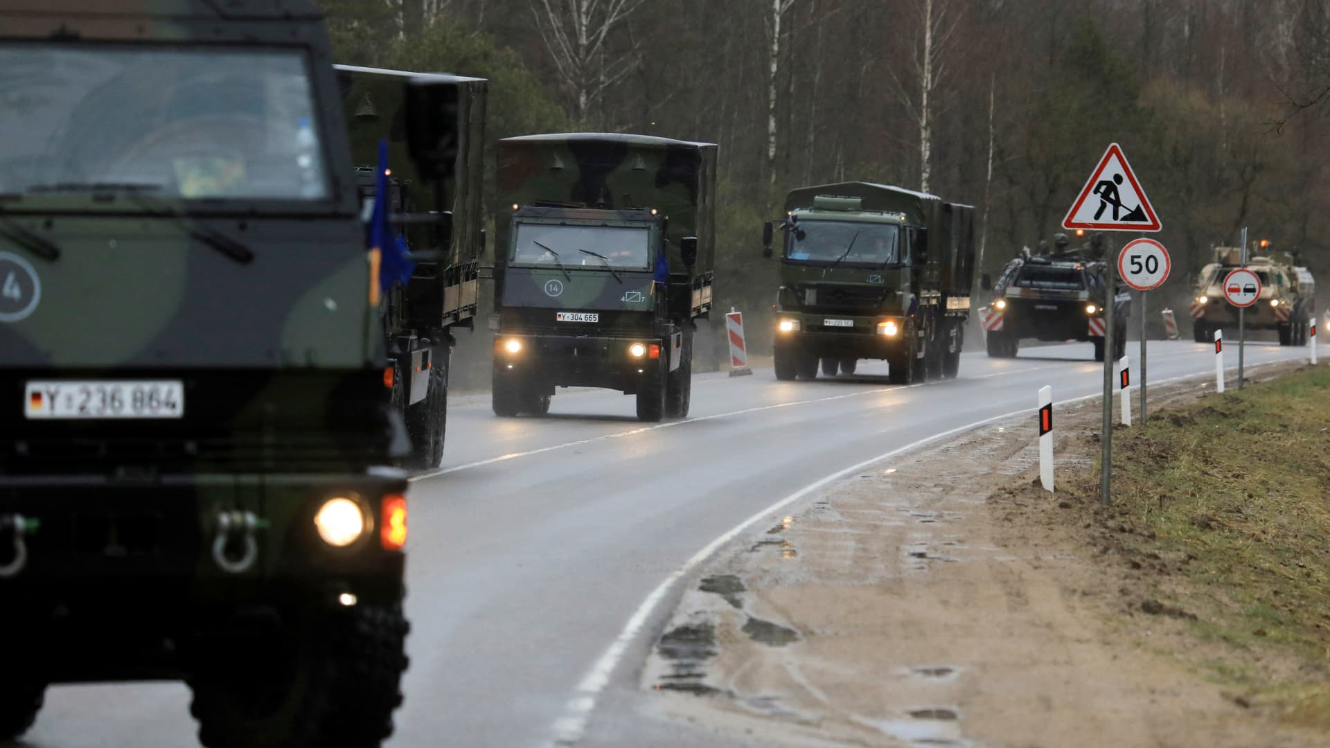 Vehicles of the German armed forces Bundeswehr from the Griffin barracks arrive at the NATO enhanced Forward Presence Battle Group Battalion in Lithuania in Rukla, Lithuania on February 17, 2022.