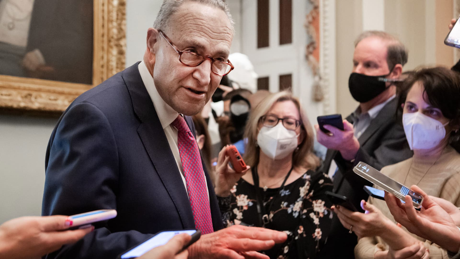 US Senate Majority Leader Chuck Schumer speaks with the press as he leaves a lunch with Senate Democrats at the US Capitol in Washington, DC, February 17, 2022.