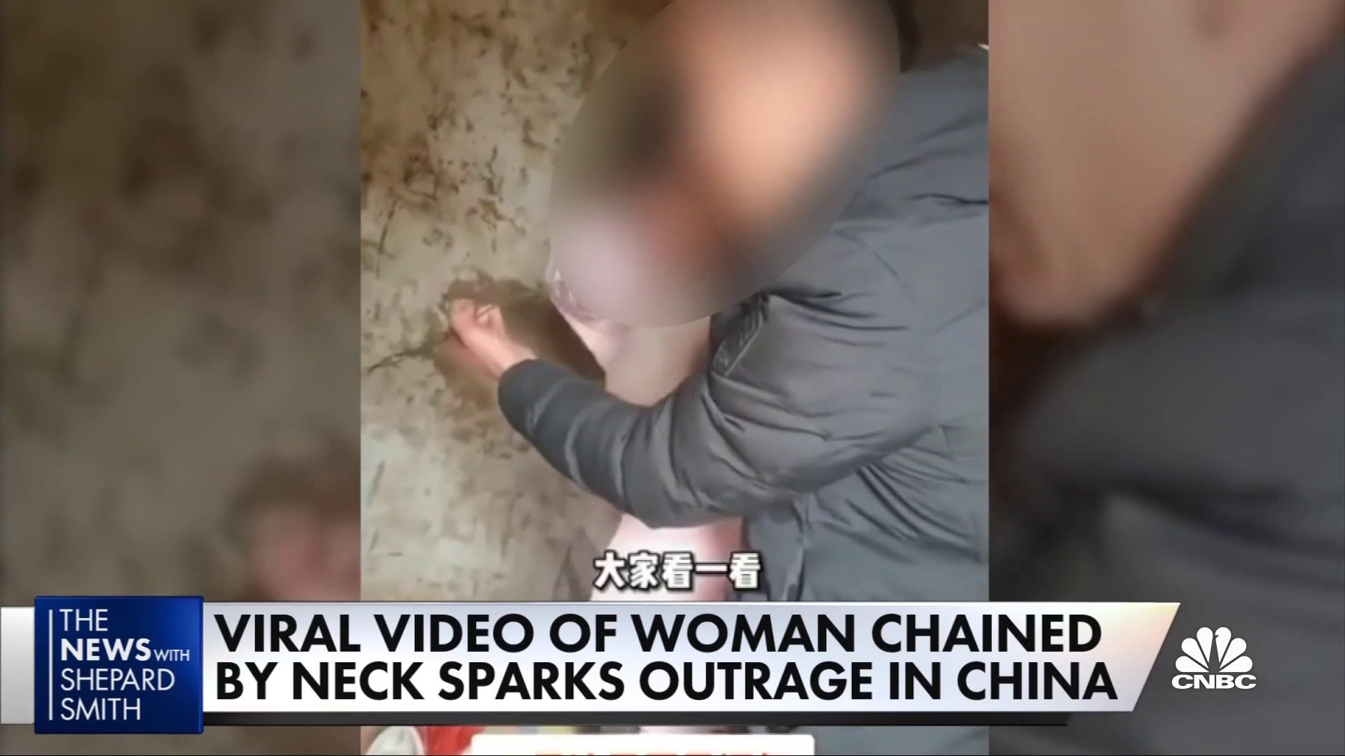 Viral video of woman chained by neck in China sparks outrage->