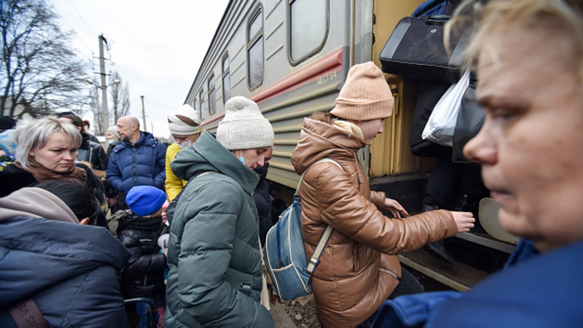 Residents of the Donetsk Peoples Republic board a train at the Donetsk-2 railway station as they evacuate to Russias Rostov-on-Don Region. Amid the escalating conflict in east Ukraine, on February 18, 2022, the heads of the Lugansk and Donetsk People's Republics announced a mass evacuation of civilians to Russia.