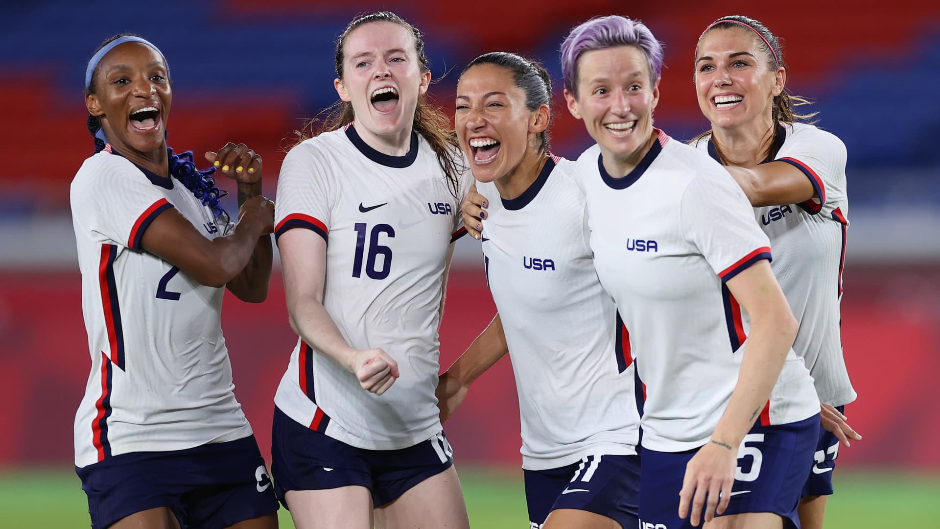 Crystal Dunn, Rose Lavelle, Christen Press, Megan Rapinoe and Alex Morgan of Team United States celebrate following their team's victory in the penalty shoot out after the Women's Quarter Final match between Netherlands and United States on day seven of the Tokyo 2020 Olympic Games at International Stadium Yokohama on July 30, 2021 in Yokohama, Kanagawa, Japan.