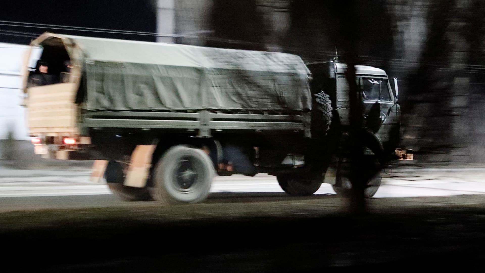 A military truck drives along a street after Russian President Vladimir Putin ordered the deployment of Russian troops to two breakaway regions in eastern Ukraine following the recognition of their independence, in the separatist-controlled city of Donetsk, Ukraine February 22, 2022.