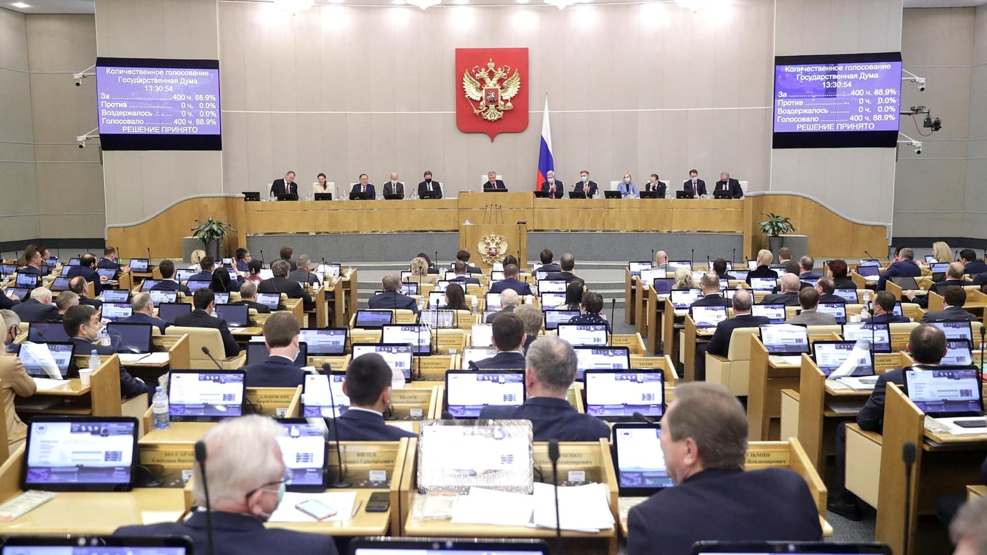 Russian lawmakers attend a session of the State Duma, the lower house of parliament, to consider approving friendship treaties with two self-proclaimed people's republics in eastern Ukraine, in Moscow, Russia February 22, 2022.