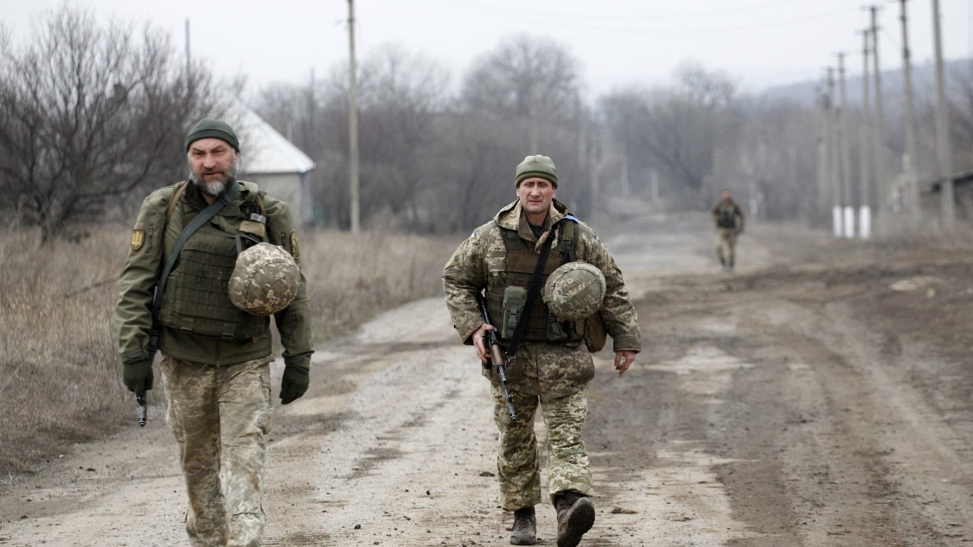Ukrainian servicemen patrol in the settlement of Troitske in the Lugansk region near the front line with Russia-backed separatists on February 22, 2022.