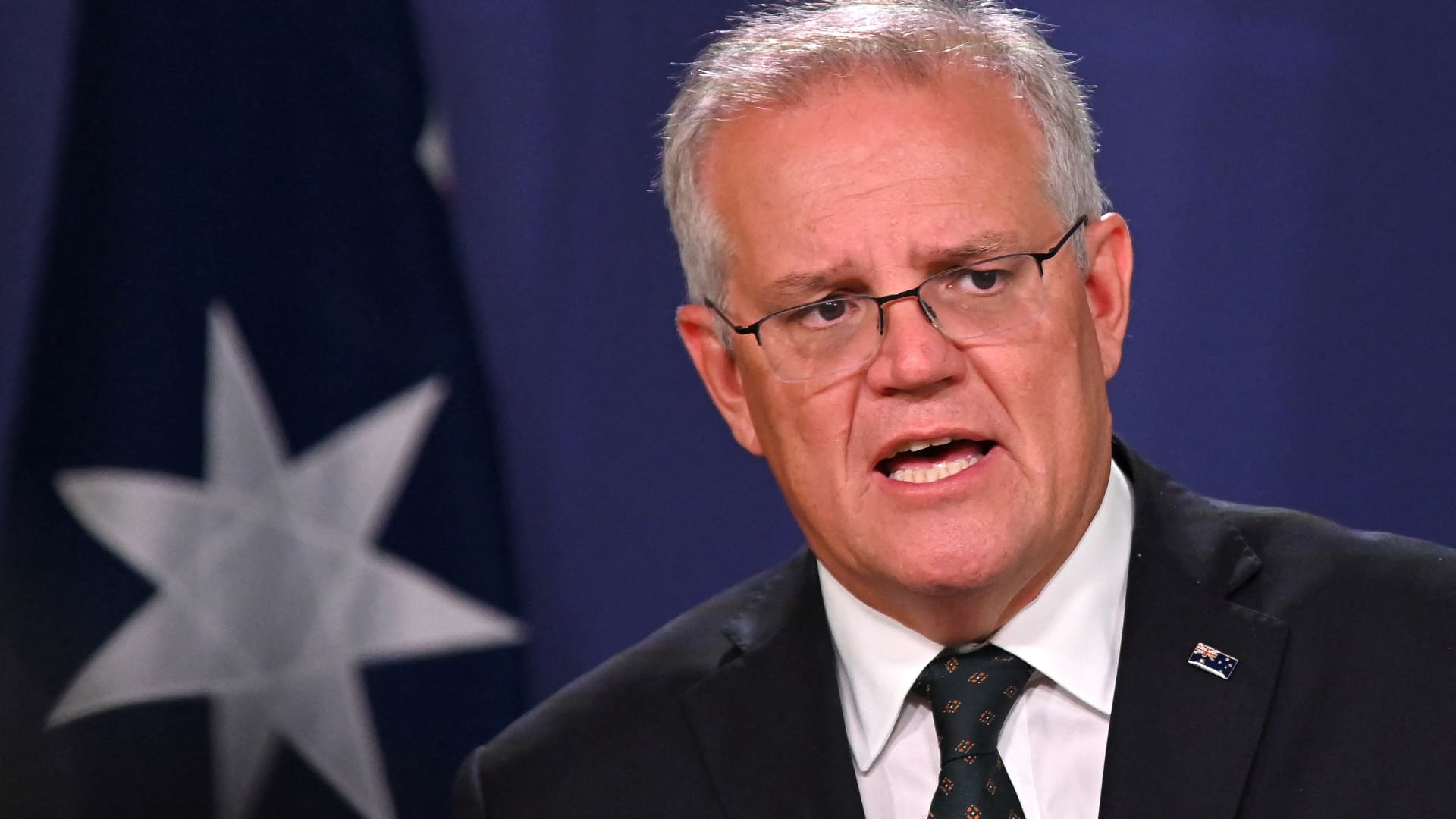 Australia's Prime Minister Scott Morrison speaks to the media to announce sanctions on top Russian officials following the invasion of eastern Ukraine, during a press conference in Sydney on February 23, 2022.