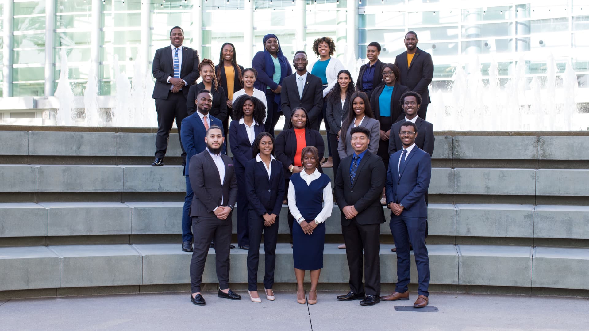 Favour Nerrise (bottom center) stands with the National Socitey of Black Engineers Executive Board and Conference Planning Committee members