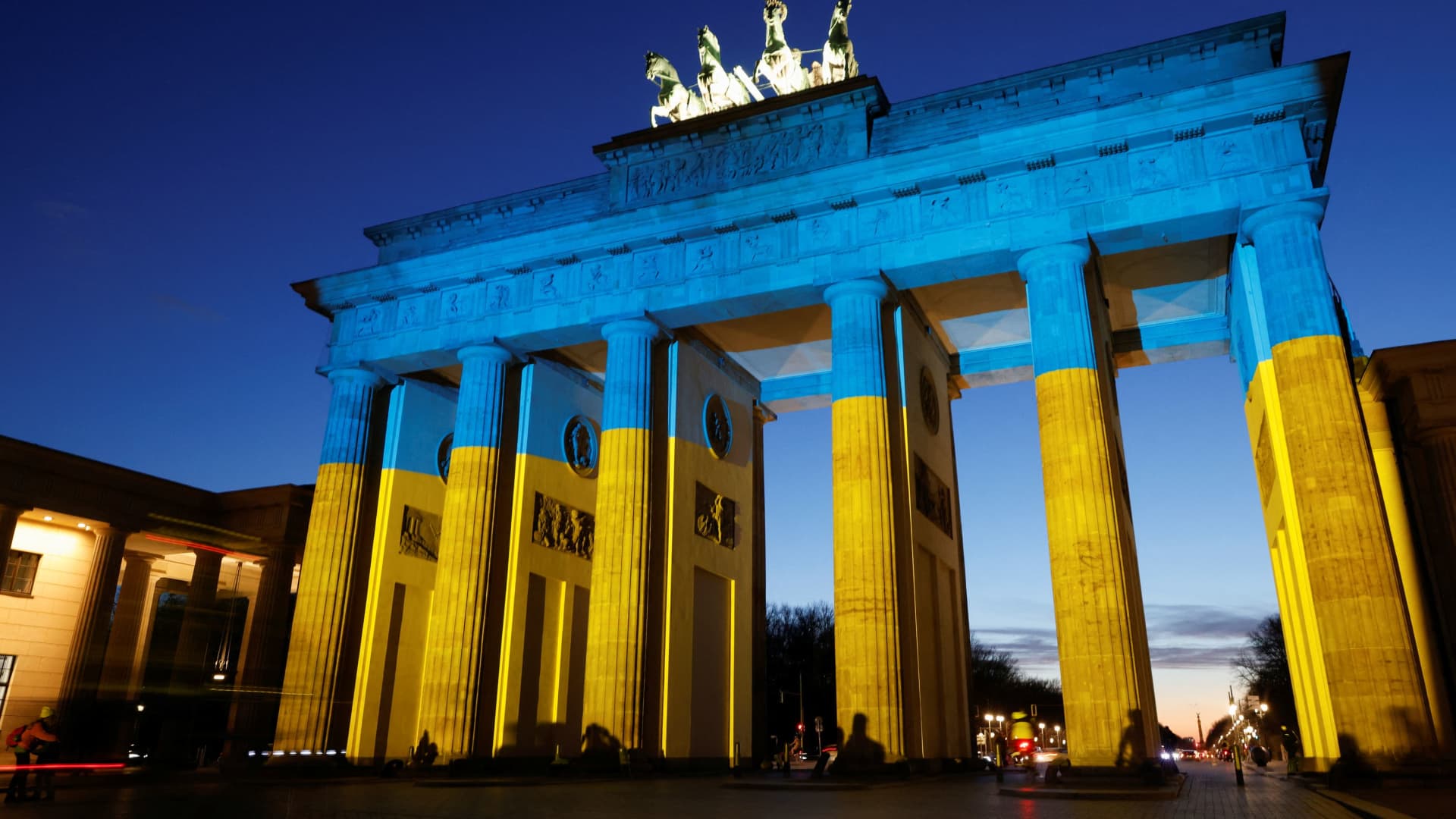 The Brandenburg Gate is illuminated in Ukrainian national colors, in Berlin, Germany February 23, 2022.