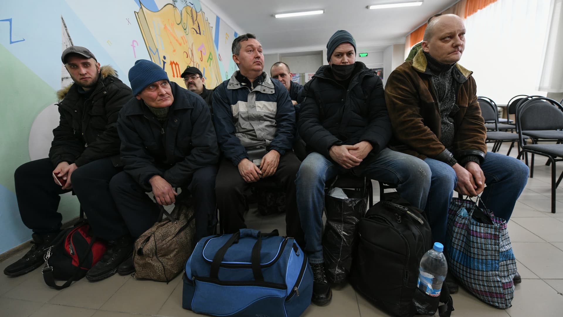 People arrive at recruiting office to register themselves after declaration of mobilization in the Donetsk region under the control of pro-Russian separatists, on February 23, 2022.