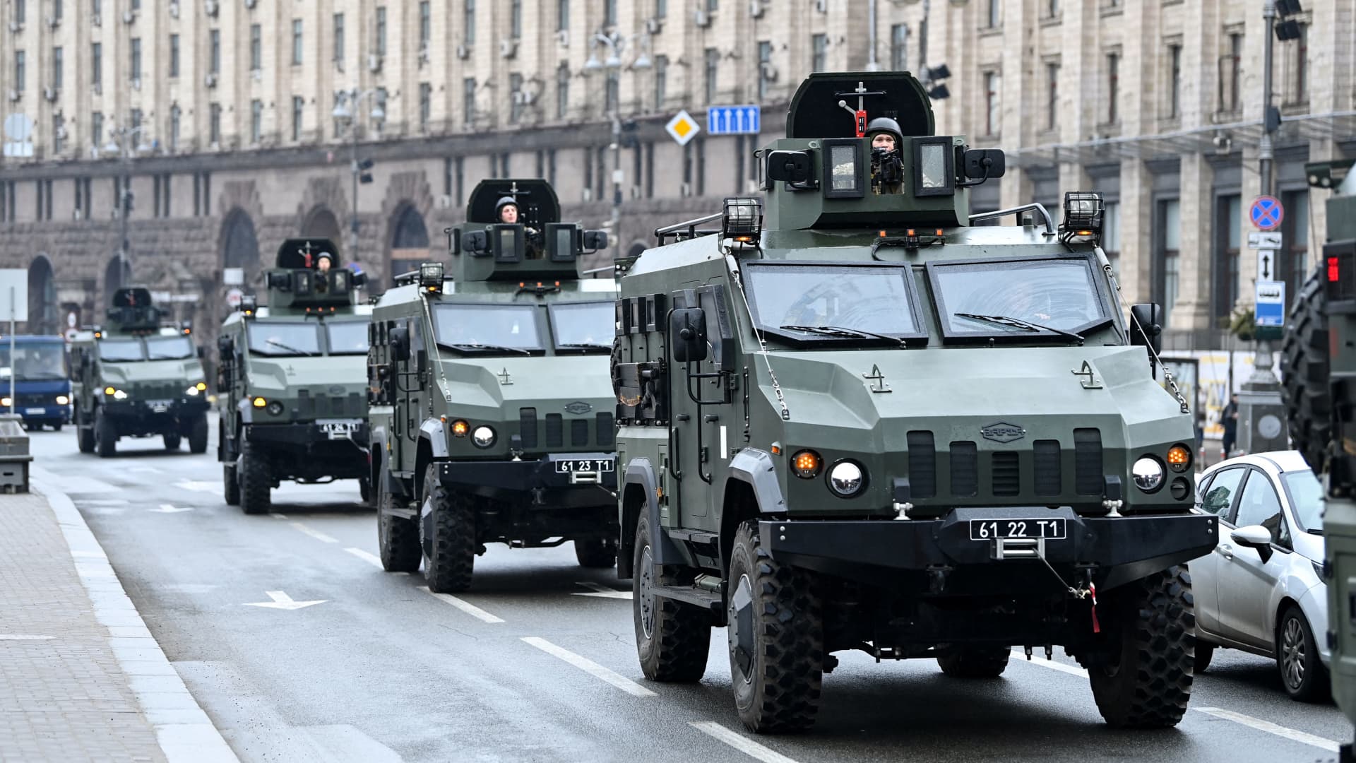 Ukrainian military vehicles move past Independence square in central Kyiv on February 24, 2022.