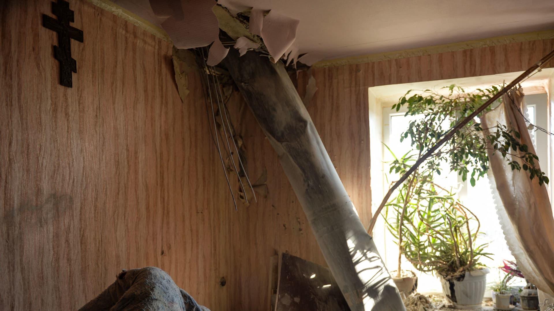 The body of a rocket stuck in a flat after recent shelling on the northern outskirts of Kharkiv on February 24, 2022.