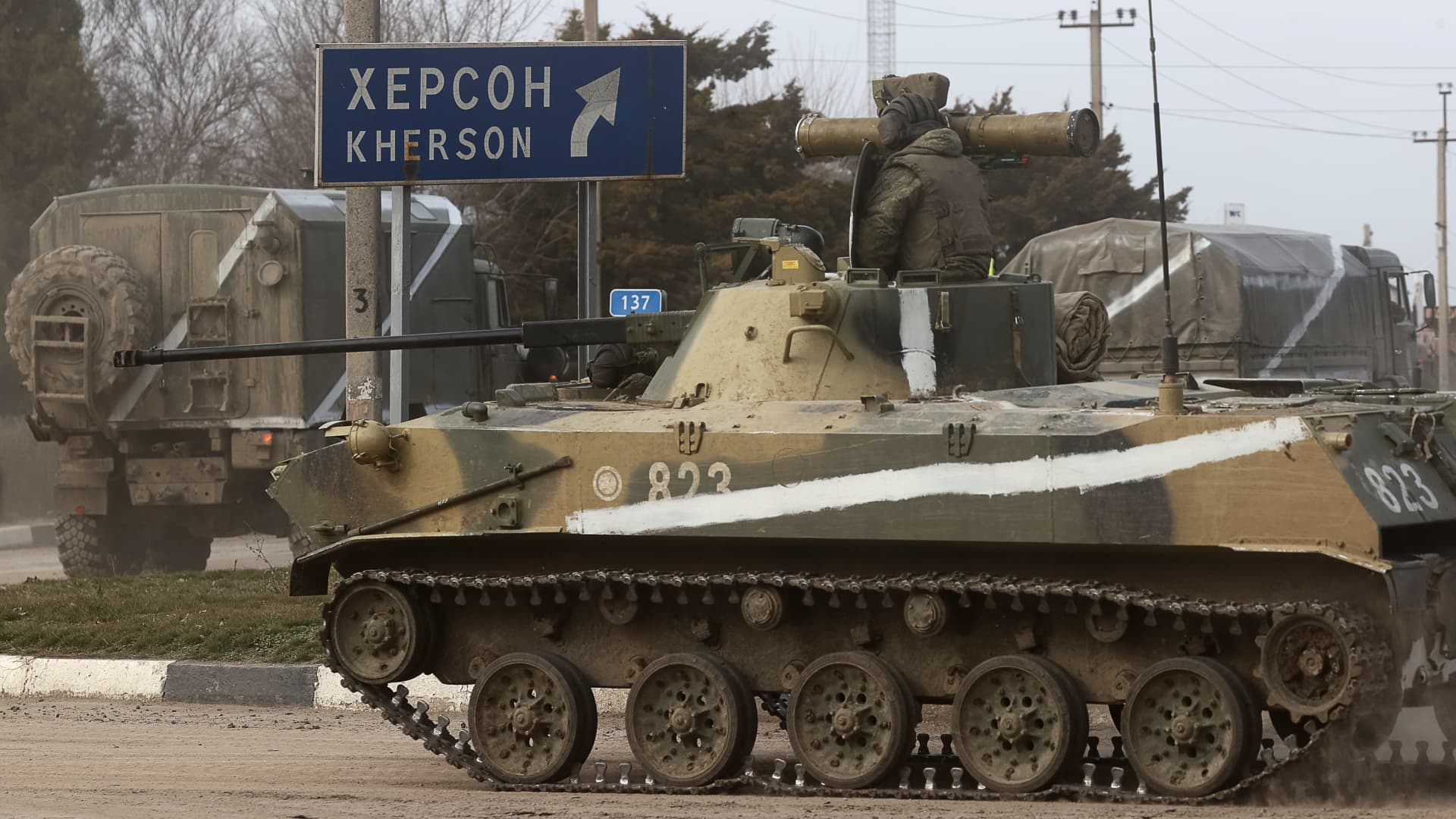 Armoured vehicles move across the town of Armyansk, northern Crimea. Early on February 24, President Putin announced a special military operation to be conducted by the Russian Armed Forces in response to appeals for help from the leaders of the Donetsk and Lugansk People's Republics.