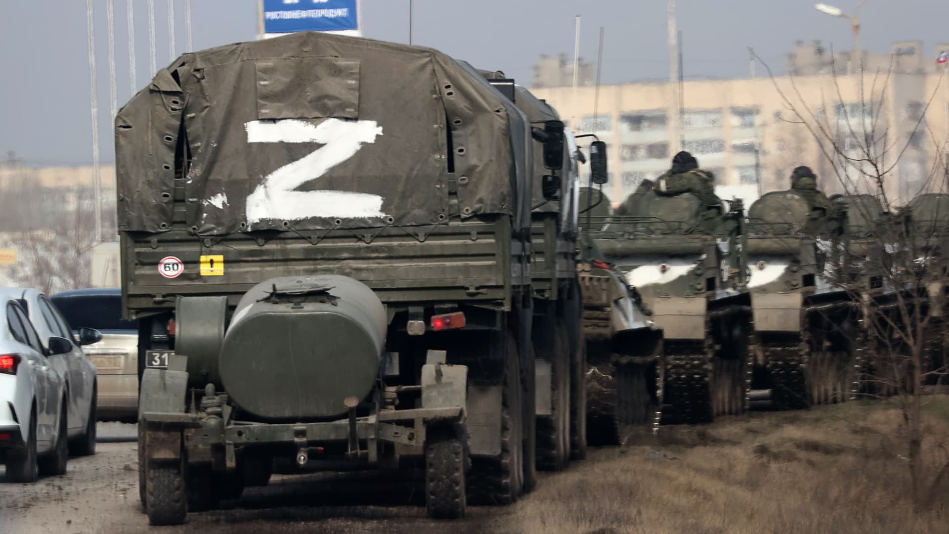 A column of army trucks moves across the town of Armyansk, northern Crimea. Early on February 24, President Putin announced a special military operation to be conducted by the Russian Armed Forces in response to appeals for help from the leaders of the Donetsk and Lugansk People's Republics.