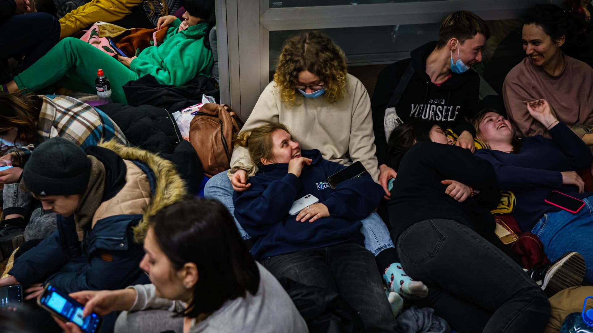 Hundreds of people seek shelter underground, on the platform, inside the dark train cars, and even in the emergency exits, in metro subway station as the Russian invasion of Ukraine continues, in Kharkiv, Ukraine, Thursday, Feb. 24, 2022.