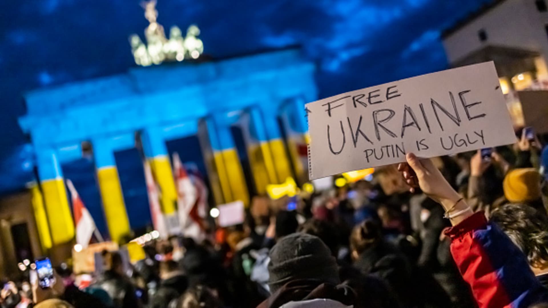 People protest in front of the Brandenburg gate against the Russian invasion of Ukraine on February 24, 2022 in Berlin, Germany. Russia has begun a large-scale attack on Ukraine, with explosions reported in multiple cities and far outside the restive eastern regions held by Russian-backed rebels.