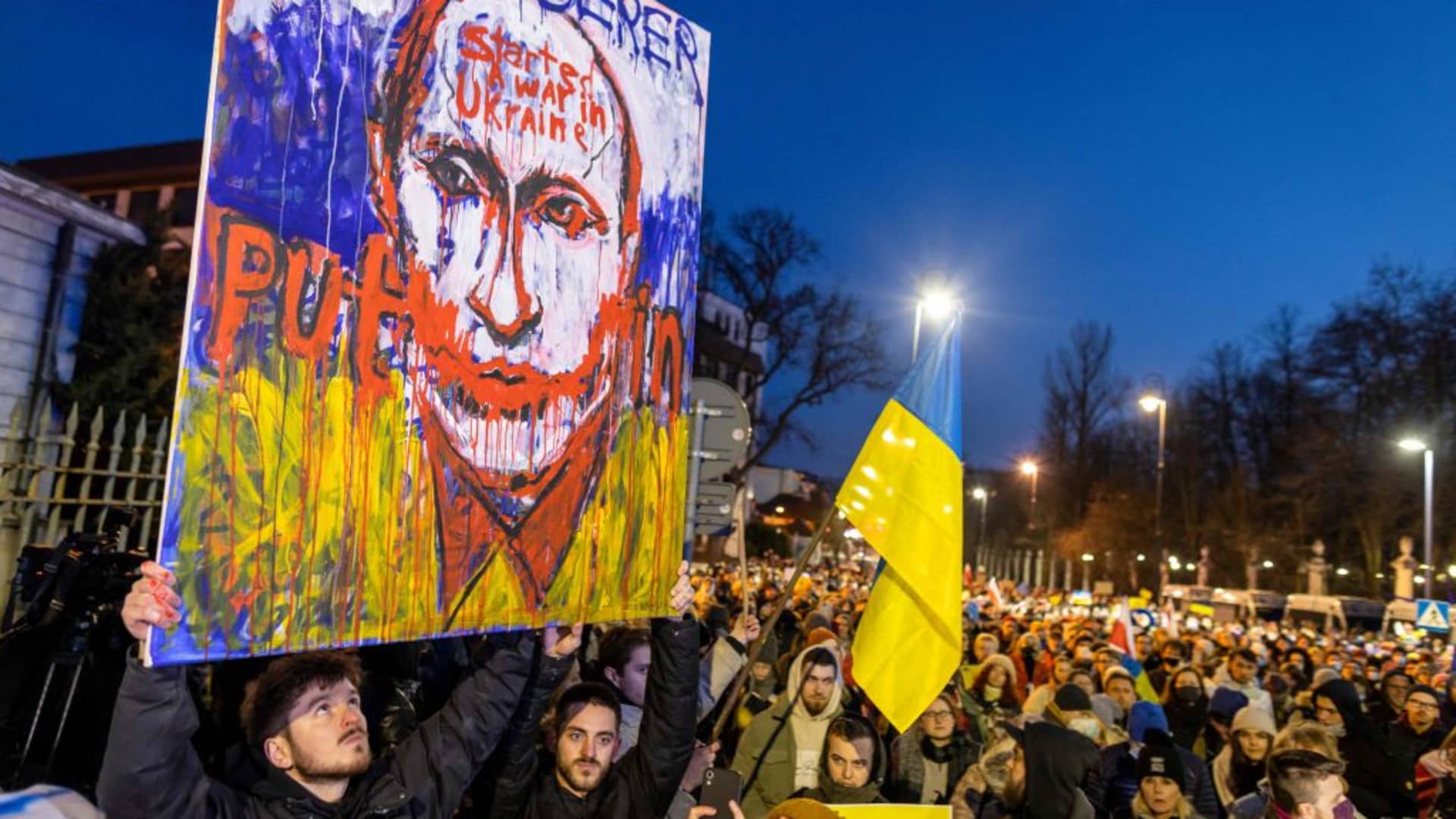 Demonstrators take part in the protest against Russia's agression on Ukraine, in front of Russian embassy in Warsaw, on February 24, 2022.