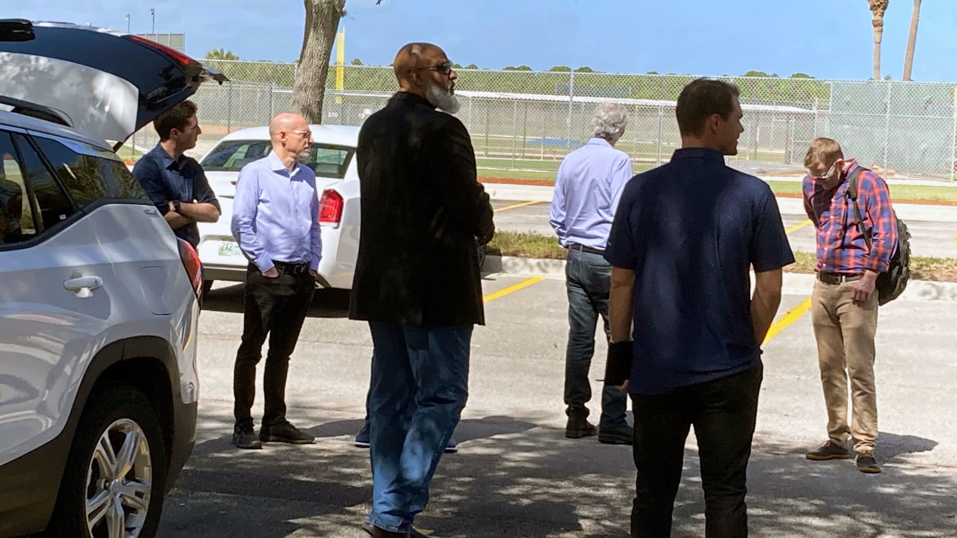 Major League Baseball Players Association executive director Tony Clark, left foreground, and chief negotiator Bruce Meyer, second from left, arrive at Roger Dean Stadium in Jupiter, Fla., Monday, Feb. 21, 2022.