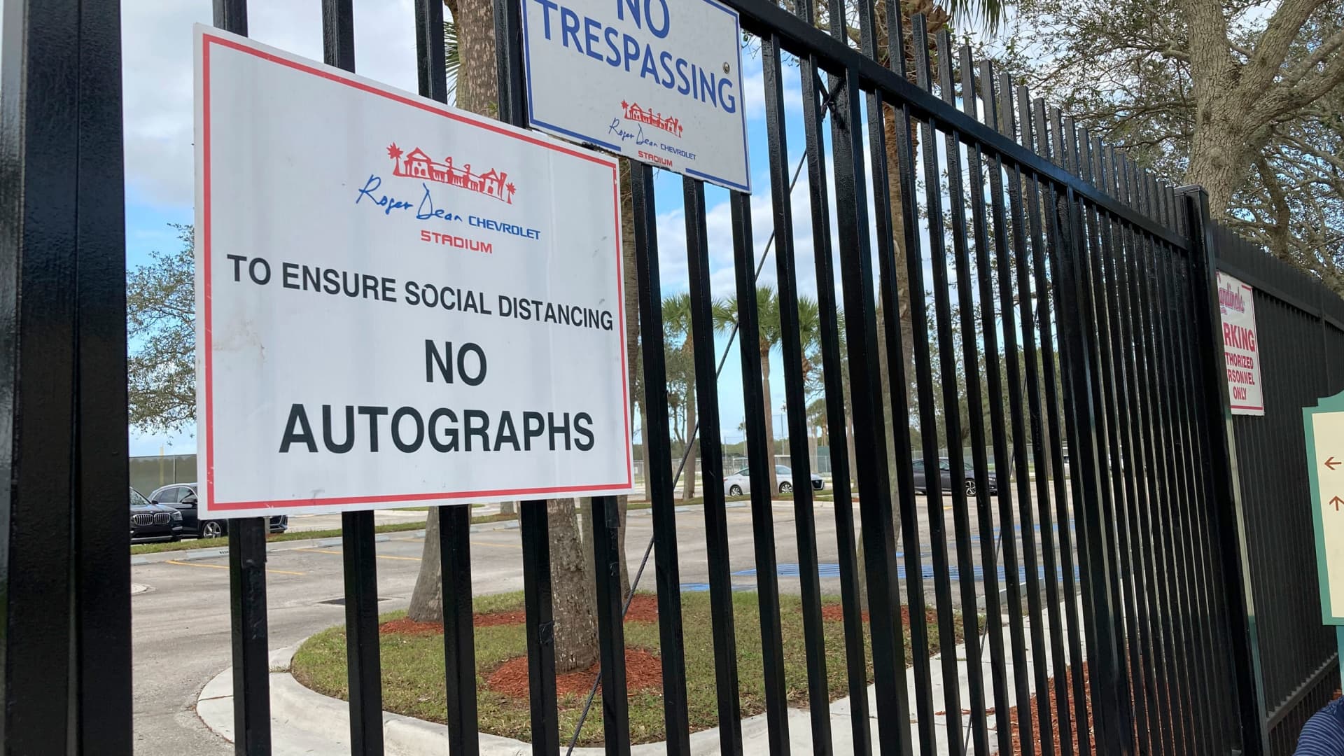 Signs are posted outside Roger Dean Stadium in Jupiter, Fla., Monday, Feb. 21, 2022. Baseball labor negotiations moved to the spring training ballpark from New York as players and owners join the talks, which enter a more intensive phase with perhaps a week left to salvage opening day on March 31.