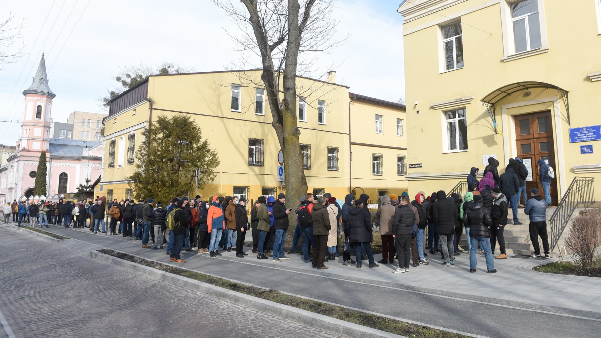 People queue to donate blood for the army at the Blood Service Center in the western Ukrainian city of Lviv on February 25, 2022.