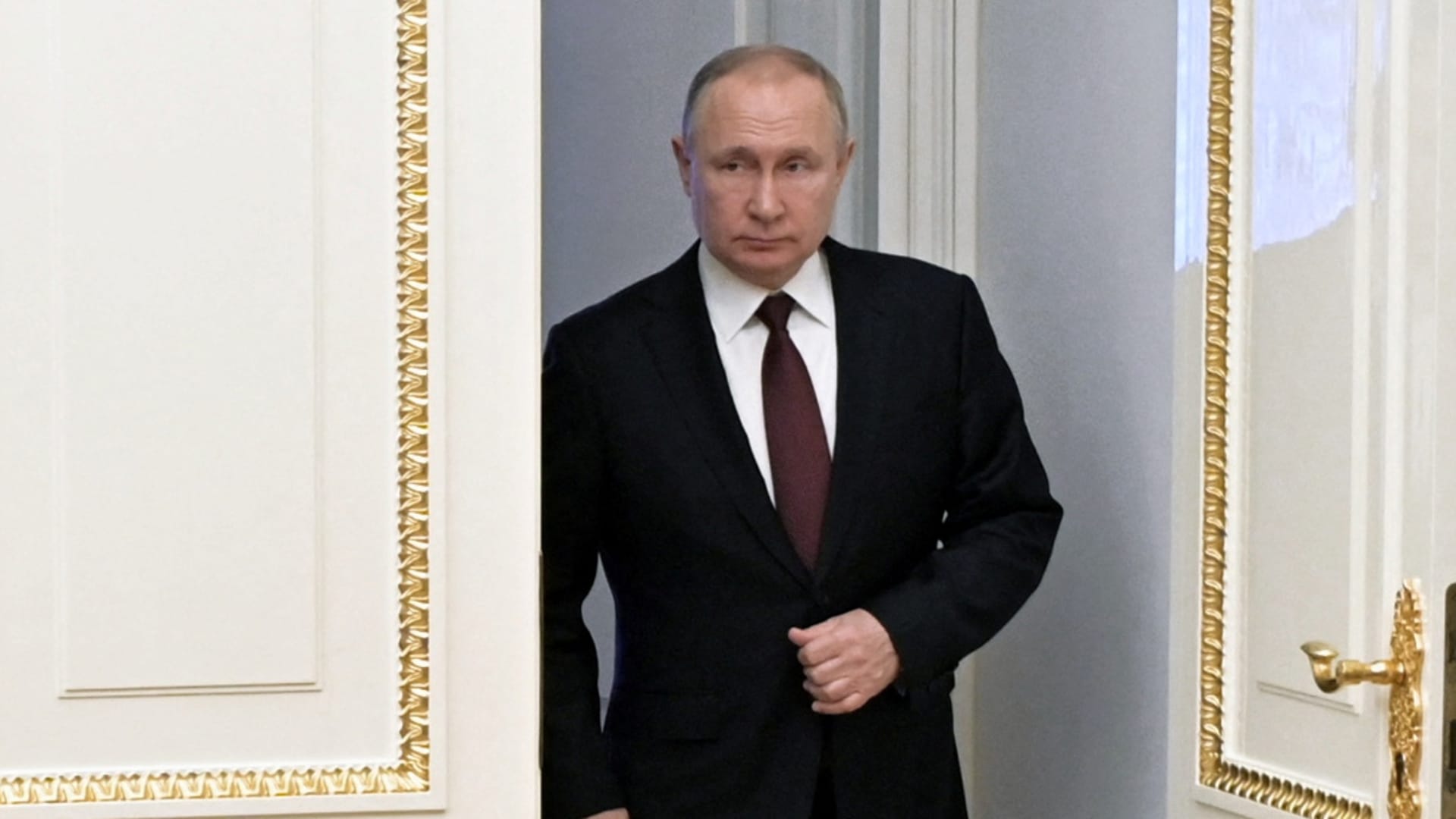 Russian President Vladimir Putin enters a hall before a meeting with members of the Security Council via a video link in Moscow, Russia February 25, 2022.