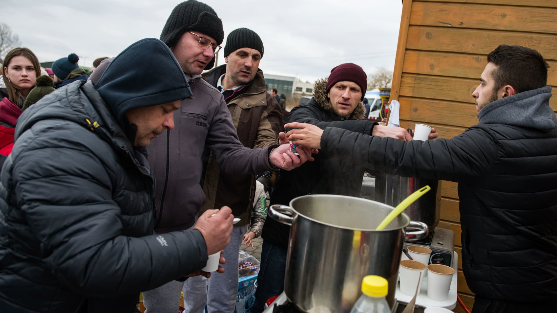 Ukrainian refugees are seen at the food distribution point at the border crossing in Medyka. Ukrainian refugees at the Medyka border crossing.