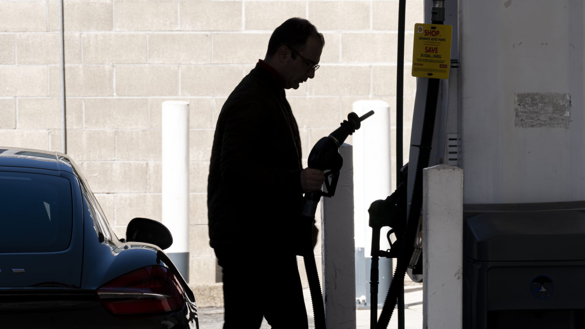 A driver removes a gas nozzle at a Shell gas station in San Francisco, California, U.S., on Friday, Feb. 25, 2022.