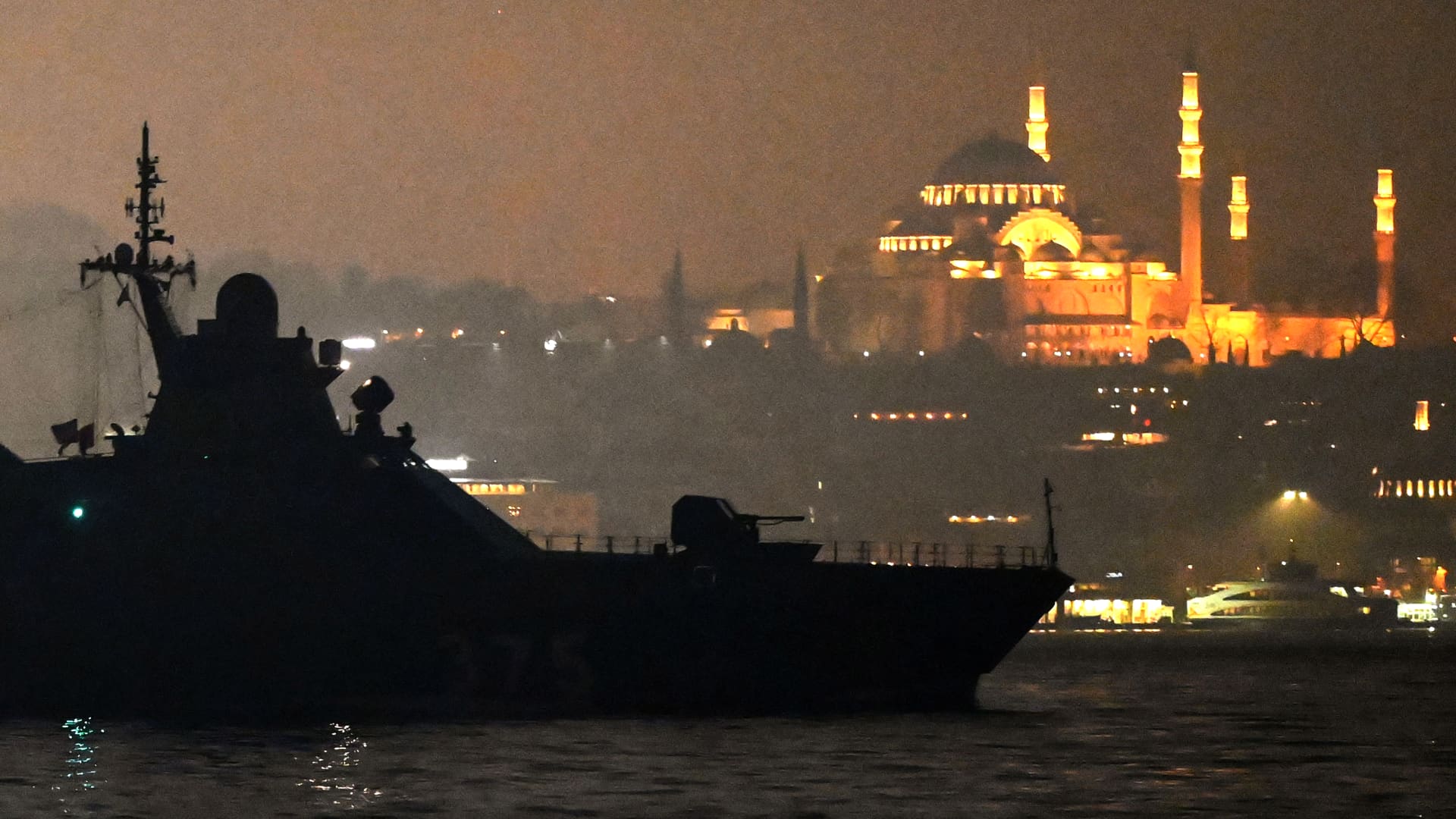Russian Navy's Project 22160 Patrol Vessel Dmitriy Rogachev 375 sails through the Bosphorus Strait on the way to the Black Sea past the city Istanbul as Suleymaniye mosque is seen in the backround on February 16, 2022.
