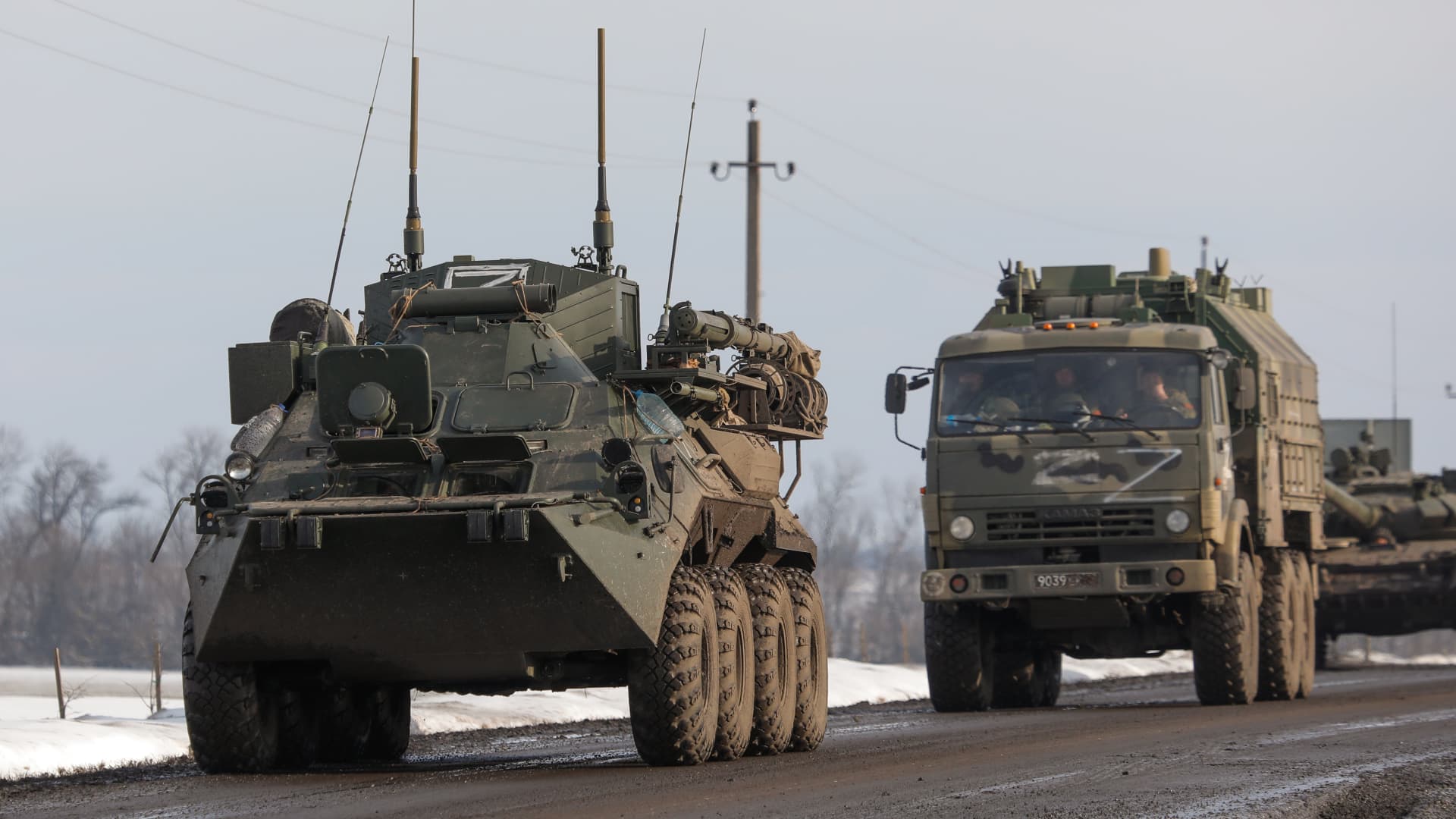 A column of Russian military vehicles is seen near the village of Oktyabrsky, Belgorod Region, near the Russian-Ukrainian border. Early on 24 February, Russia's President Putin announced his decision to launch a special military operation after considering requests from the leaders of the Donetsk People's Republic and the Lugansk People's Republic.