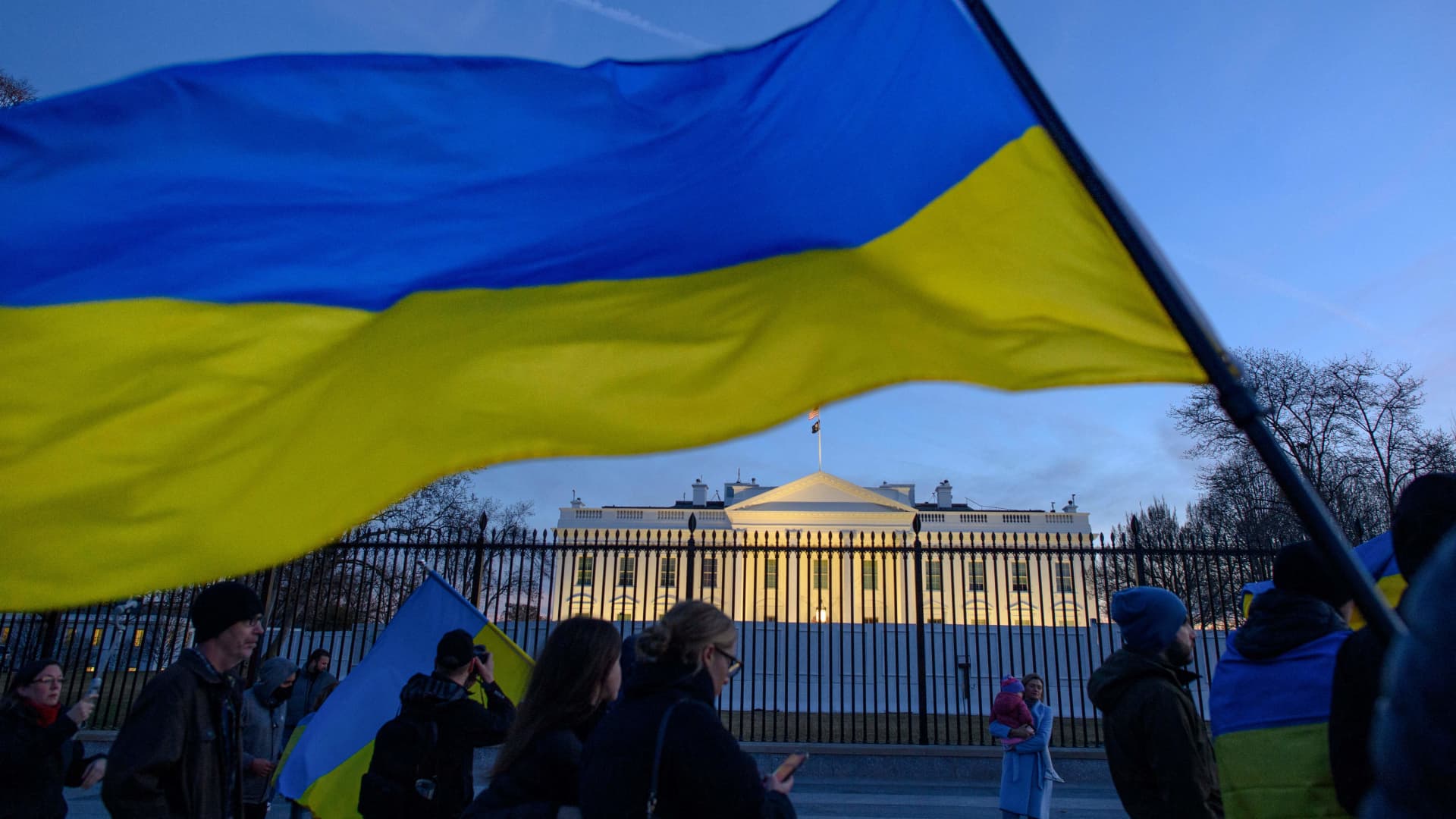 Activists hold Ukranian flags as they protest against Russias invasion of Ukraine during a rally at Lafayette Square, across from the White House, in Washington, DC on February 25, 2022.