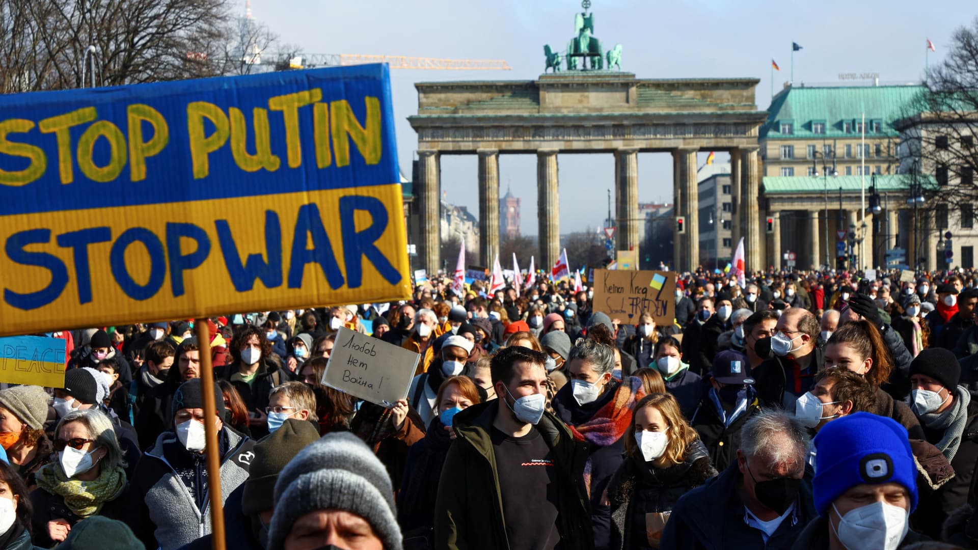Demonstrators march during an anti-war protest, after Russia launched a massive military operation against Ukraine, outside the Brandenburg Gate in Berlin, Germany, February 27, 2022.